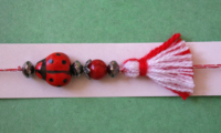 bracelet martenitsa with ladybug and ruby red bead